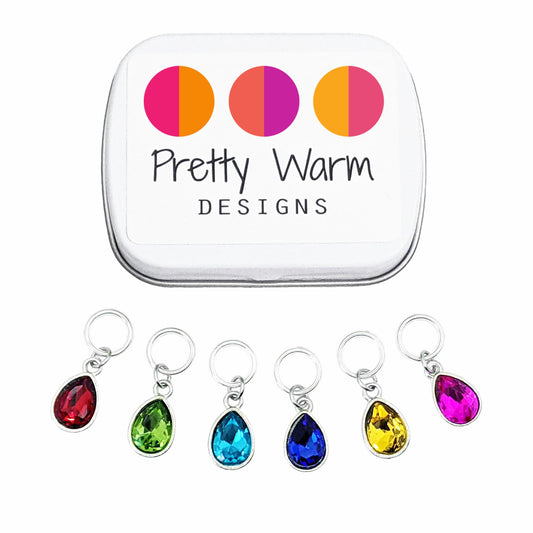 Pretty Warm Designs Rainbow Crystal Drop Stitch Markers for Knitting with Storage Tin - Set of 6 Sparkly Jewel-Tone Charms on Snag-Free Rings - Handmade Yarn Notions