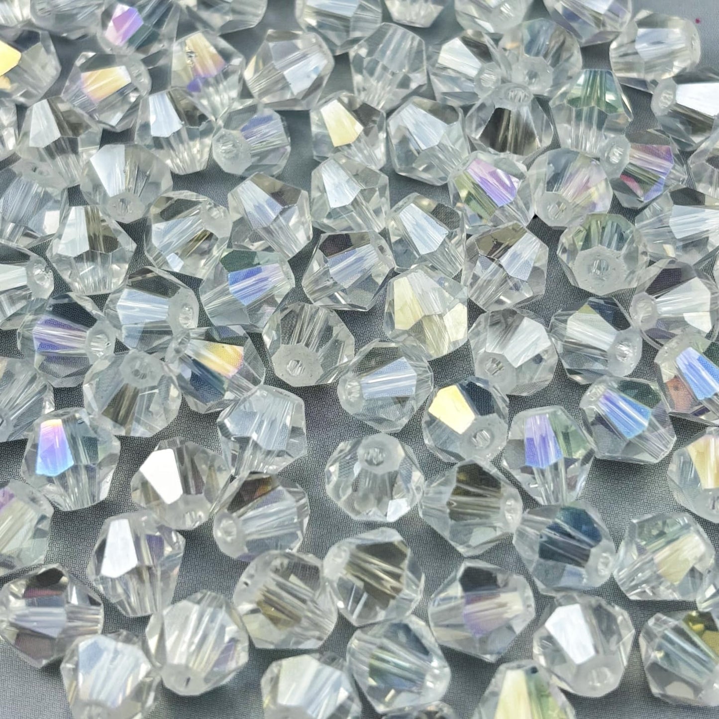 Pinhoollgo 600pcs 3mm Bicone Crystal Glass Beads Faceted Bicone Crystal Beads Bulk Glass Spacer Beads for Bracelets Necklace Pendants Earrings DIY Jewelry Craft Making(Transparent AB)