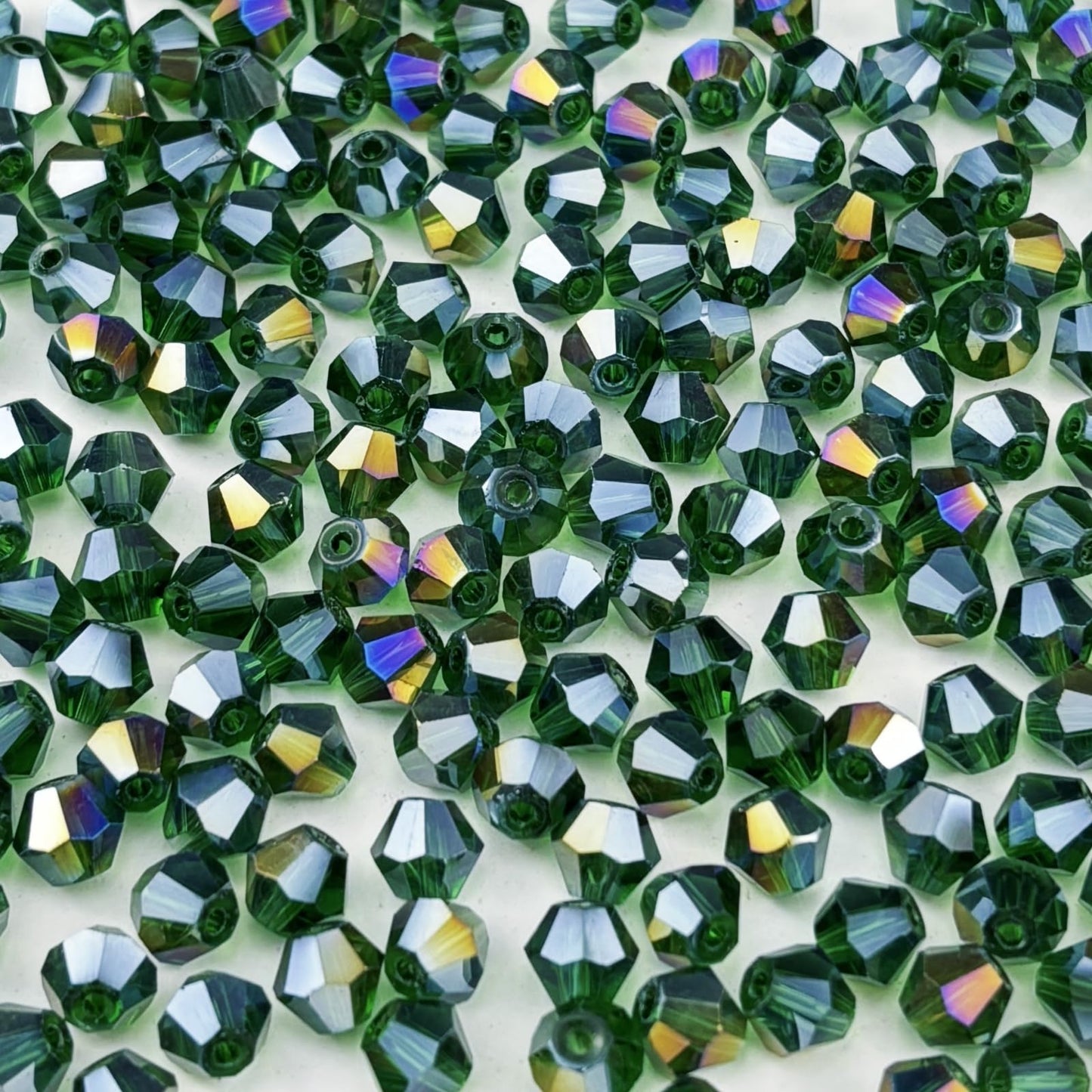 Pinhoollgo 500pcs 4mm Bicone Crystal Glass Beads Faceted Bicone Crystal Beads Bulk Glass Spacer Beads for Bracelets Necklace Pendants Earrings DIY Jewelry Craft Making(Dark Green AB)